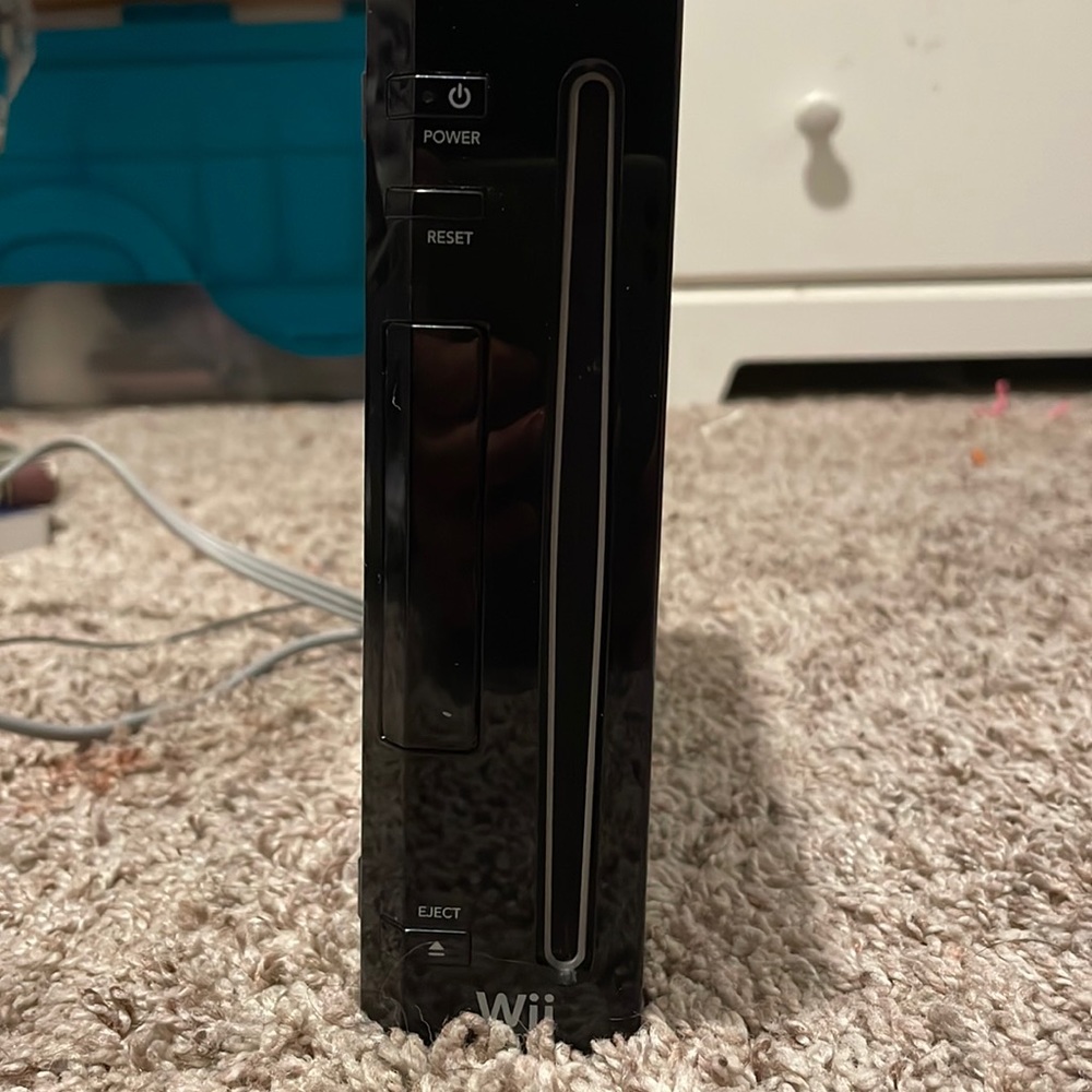 Nintendo wii with all controls plugs wires and two games with extra connects